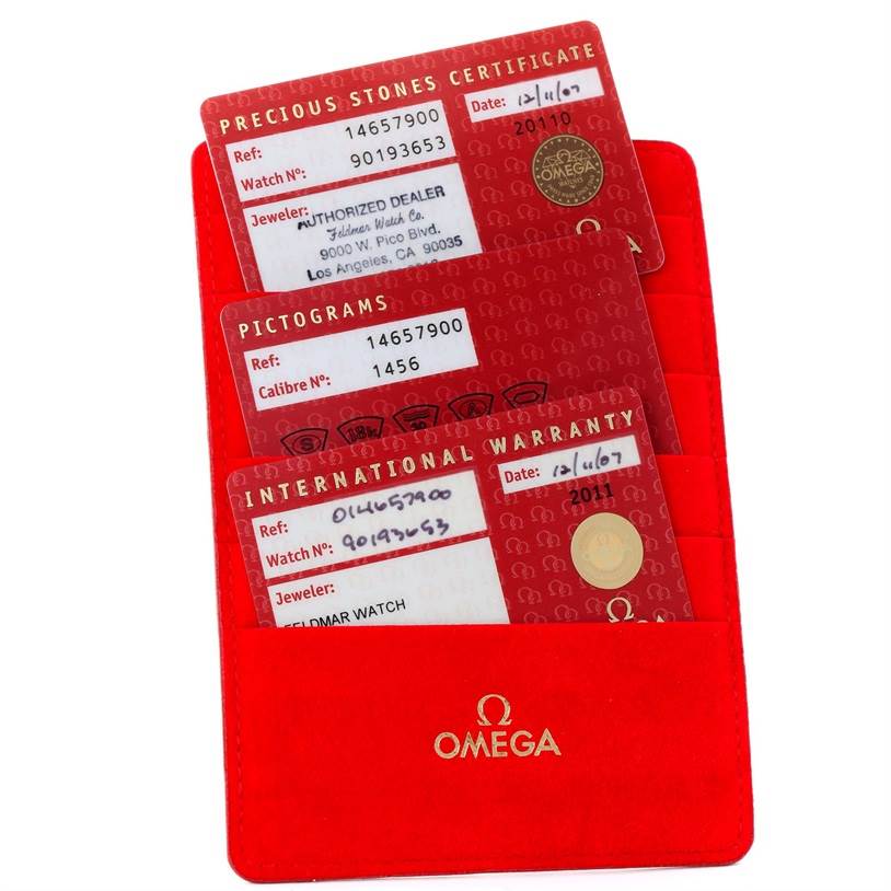 This image shows warranty and certification cards in a red Omega 1465.79.00 Women
s Stainless Steel Mother of Pearl Dial 1465.79.00 Women
s Stainless Steel Mother of Pearl Dial holder for the Omega 1465.79.00 Women
s Stainless Steel Mother of Pearl Dial 1465.79.00 Women
s Stainless Steel Mother of Pearl Dial Constellation Iris My Choice Steel Multi Stone Watch 1465.79.00.