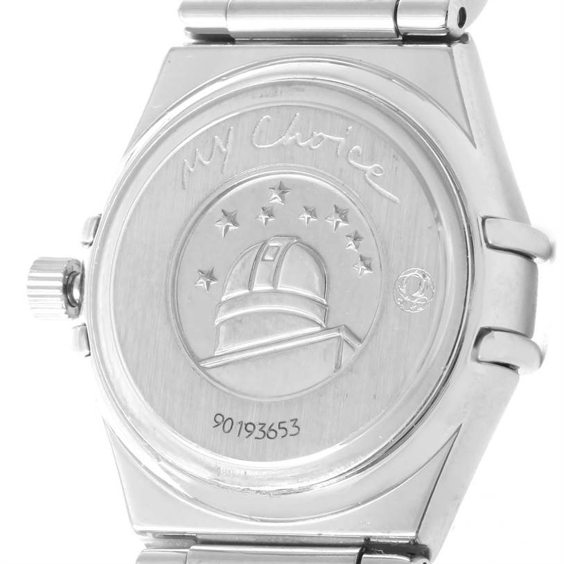 The image shows the back case of the Omega 1465.79.00 Women
s Stainless Steel Mother of Pearl Dial 1465.79.00 Women
s Stainless Steel Mother of Pearl Dial Constellation Iris My Choice Steel Multi Stone Watch model 1465.79.00.