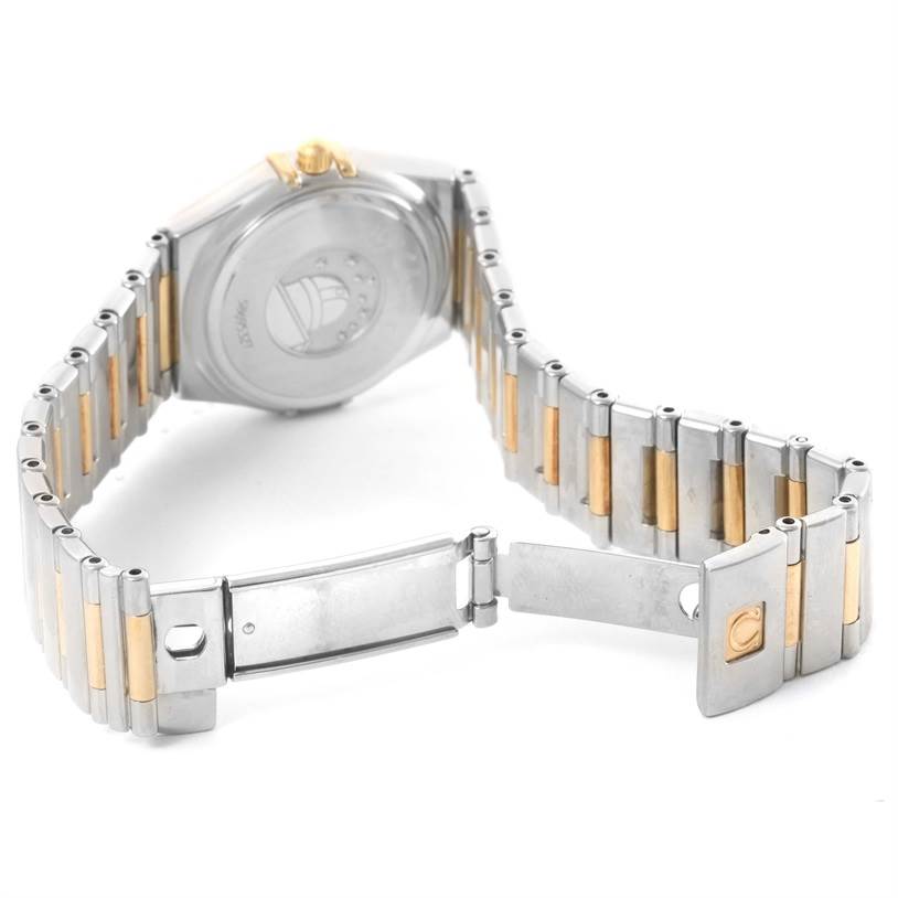 The image shows the back and partially open clasp of the Omega 1376.75.00 Women
s Steel and Gold (two tone) Mother of Pearl Dial 1376.75.00 Women
s Steel and Gold (two tone) Mother of Pearl Dial Constellation My Choice Steel Yellow Gold Diamond Watch 1376.75.00.
