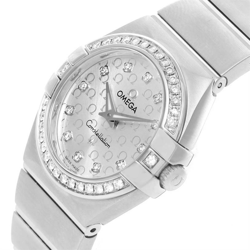 The image shows a close-up of the Omega 123.15.27.60.52.001 Women
s Stainless Steel Silver Dial 123.15.27.60.52.001 Women
s Stainless Steel Silver Dial Constellation 27mm Diamond Ladies Watch 123.15.27.60.52.001, highlighting the dial, bezel, and part of the bracelet.