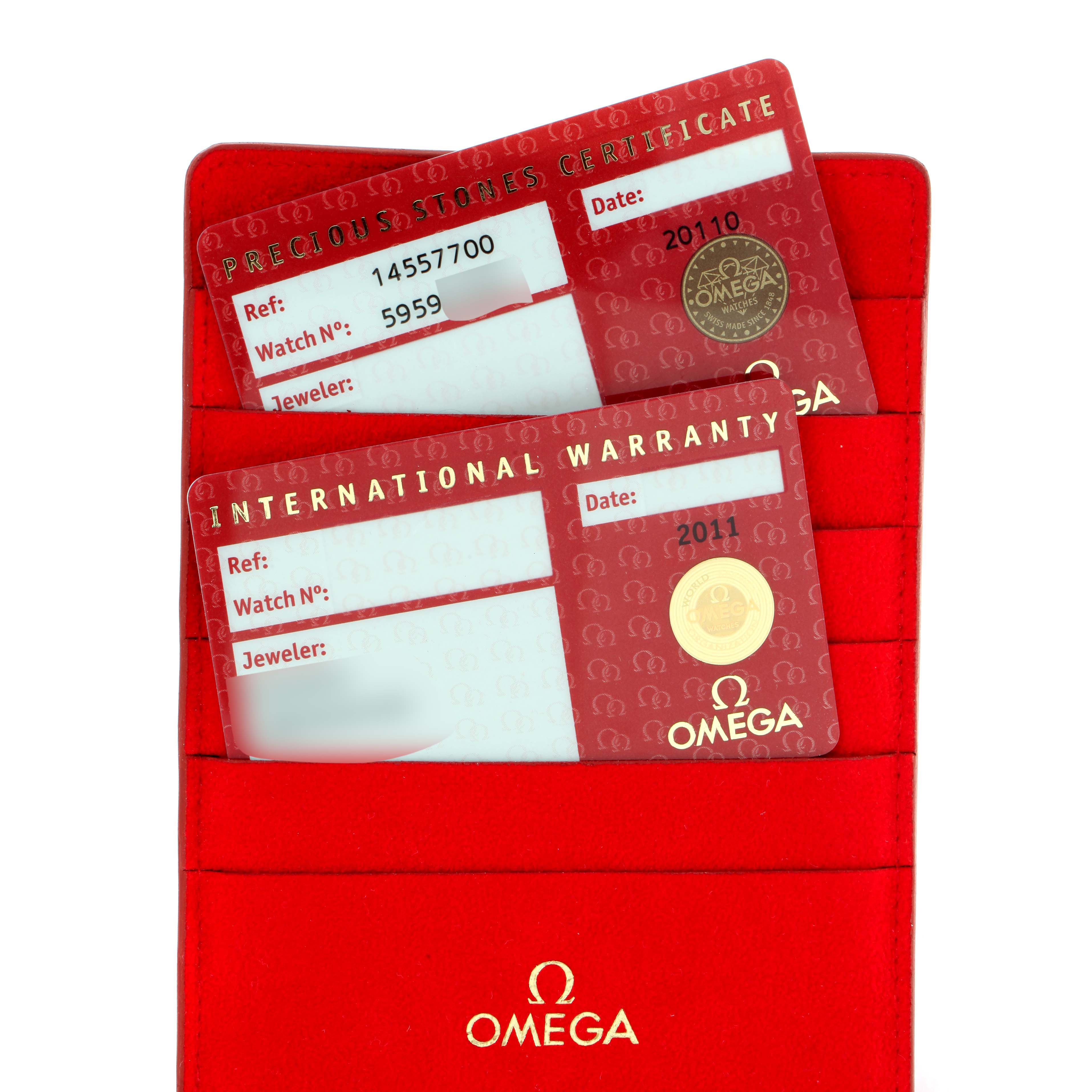 The image shows two red Omega 1455.77.00 Women's Stainless Steel Mother of Pearl Dial 1455.77.00 Women's Stainless Steel Mother of Pearl Dial cards, a Precision Stones Certificate and an International Warranty, associated with the Omega 1455.77.00 Women's Stainless Steel Mother of Pearl Dial 1455.77.00 Women's Stainless Steel Mother of Pearl Dial Constellation My Choice Diamond Steel Ladies Watch 1455.77.00.