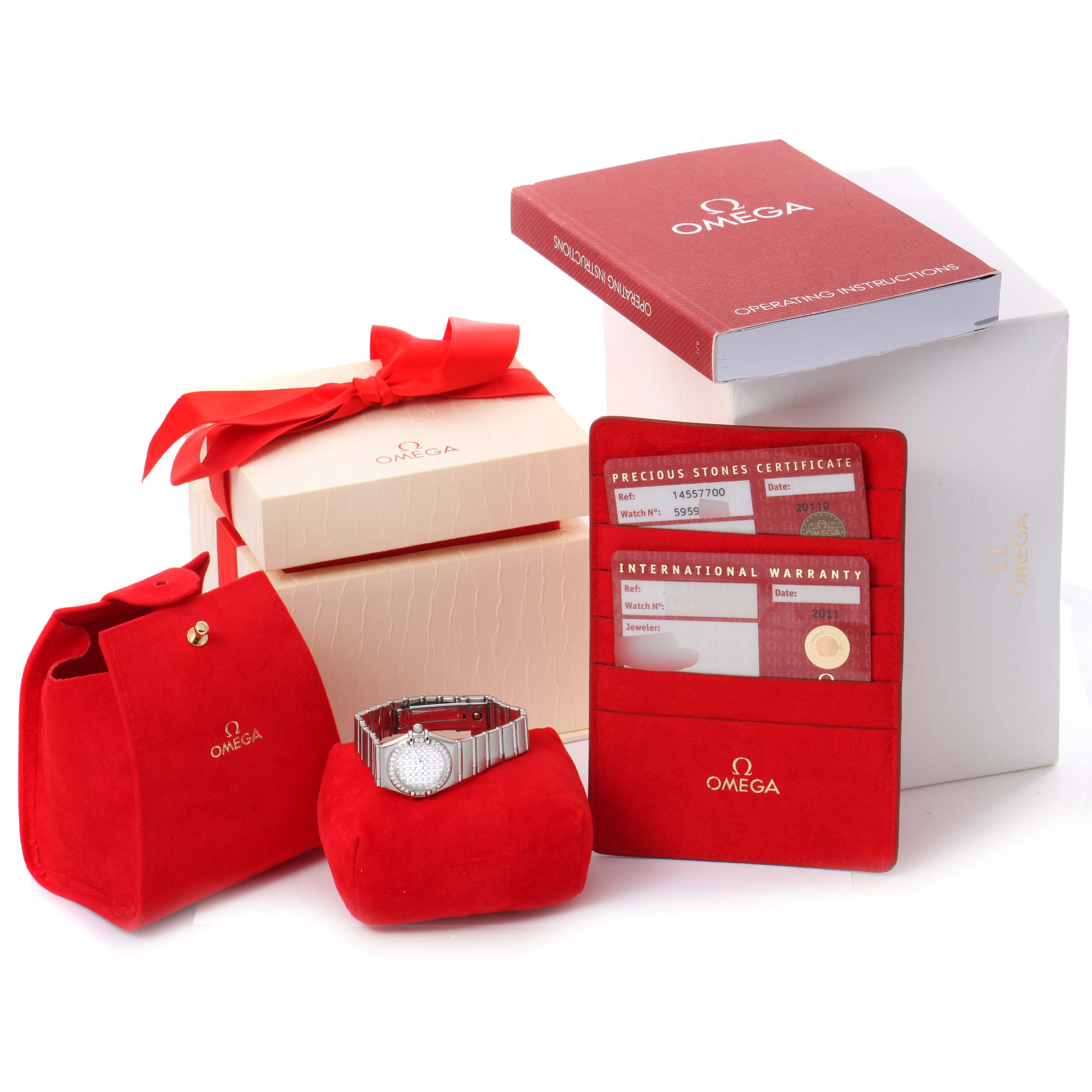 The image shows an Omega 1455.77.00 Women's Stainless Steel Mother of Pearl Dial 1455.77.00 Women's Stainless Steel Mother of Pearl Dial Constellation My Choice Diamond Steel Ladies Watch 1455.77.00 with its box, card, operating instructions, and certificates.