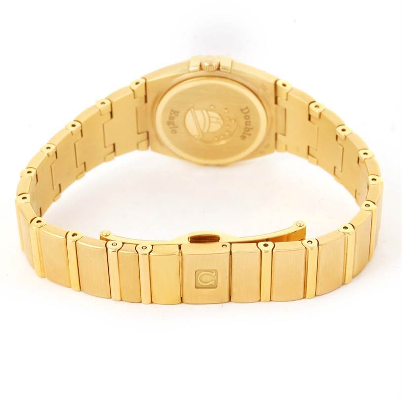 The image shows the back and bracelet of the Omega 1189.75.00 Women
s Yellow Gold Mother of Pearl Dial 1189.75.00 Women
s Yellow Gold Mother of Pearl Dial Constellation Double Eagle Yellow Gold Diamond Watch 1189.75.00.