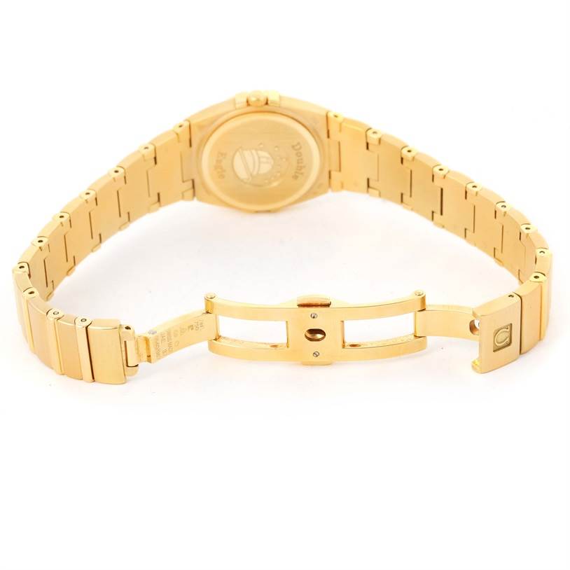 The image shows the back and bracelet of the Omega 1189.75.00 Women
s Yellow Gold Mother of Pearl Dial 1189.75.00 Women
s Yellow Gold Mother of Pearl Dial Constellation Double Eagle Yellow Gold Diamond Watch 1189.75.00.