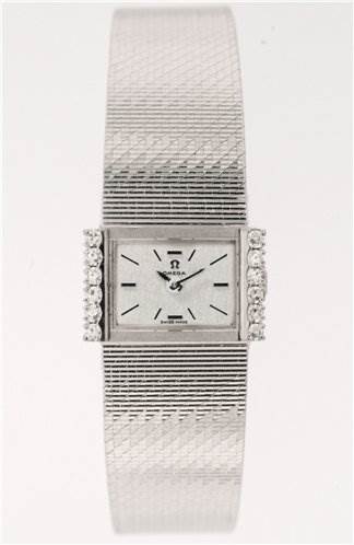 The image shows a front view of the Omega Women's White Gold Silver Dial Women's White Gold Silver Dial Vintage Ladies 18k Gold with Diamonds watch, highlighting the face, band, and diamond accents.
