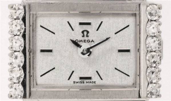 The image shows a front view of the Omega Women's White Gold Silver Dial Women's White Gold Silver Dial Vintage Ladies 18k w Gold w Diamonds watch face, revealing its dial and diamond-encrusted bezel.