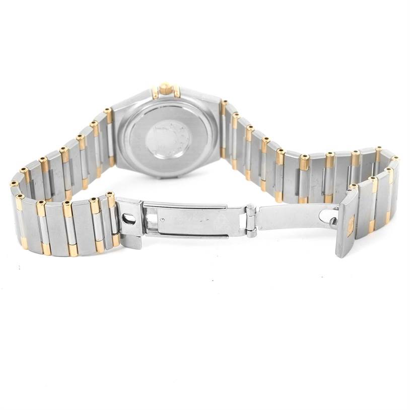 The image shows the back and the partially opened clasp of the Omega 1376.75.00 Women
s Steel and Gold (two tone) Mother of Pearl Dial 1376.75.00 Women
s Steel and Gold (two tone) Mother of Pearl Dial Constellation My Choice Steel Yellow Gold Diamond Watch 1376.75.00.
