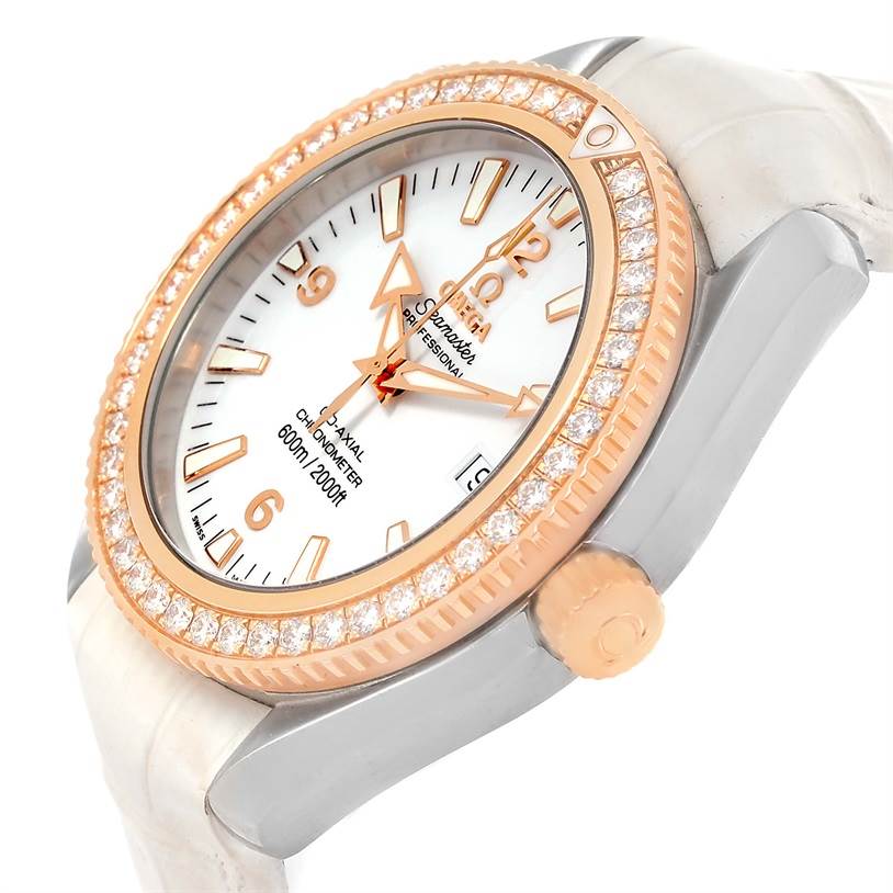 This is an angled side view of the Omega 222.28.42.20.04.001 Women's Steel and Gold (two tone) White Dial 222.28.42.20.04.001 Women's Steel and Gold (two tone) White Dial Seamaster Planet Ocean 42 mm Diamond Watch model 222.28.42.20.04.001, showing the face and bezel.