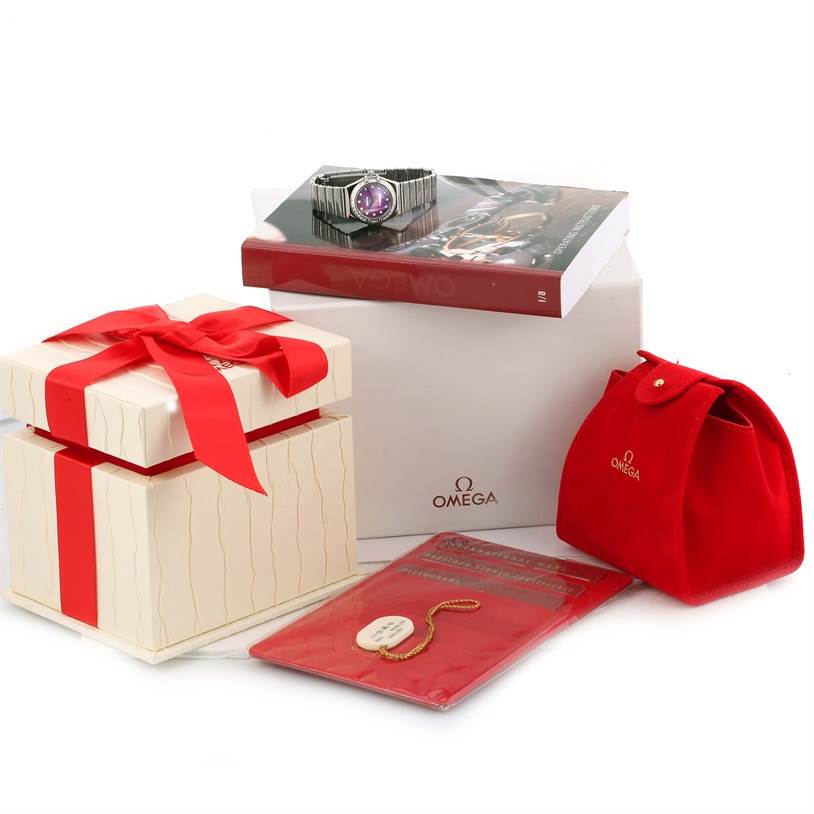 The image shows the Omega 1457.78.00 Women's Stainless Steel Mother of Pearl Dial 1457.78.00 Women's Stainless Steel Mother of Pearl Dial Constellation My Choice Diamond Limited Edition Watch 1457.78.00 along with its packaging and accessories.