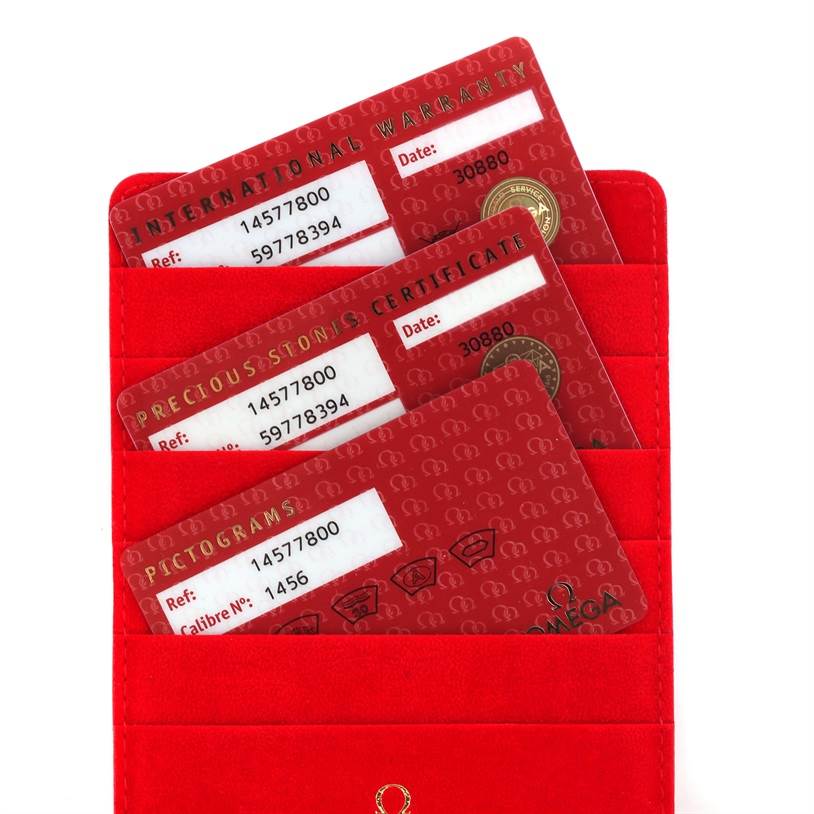 The image shows warranty and certification cards for the Omega 1457.78.00 Women's Stainless Steel Mother of Pearl Dial 1457.78.00 Women's Stainless Steel Mother of Pearl Dial Constellation My Choice Diamond Limited Edition Watch model 1457.78.00.