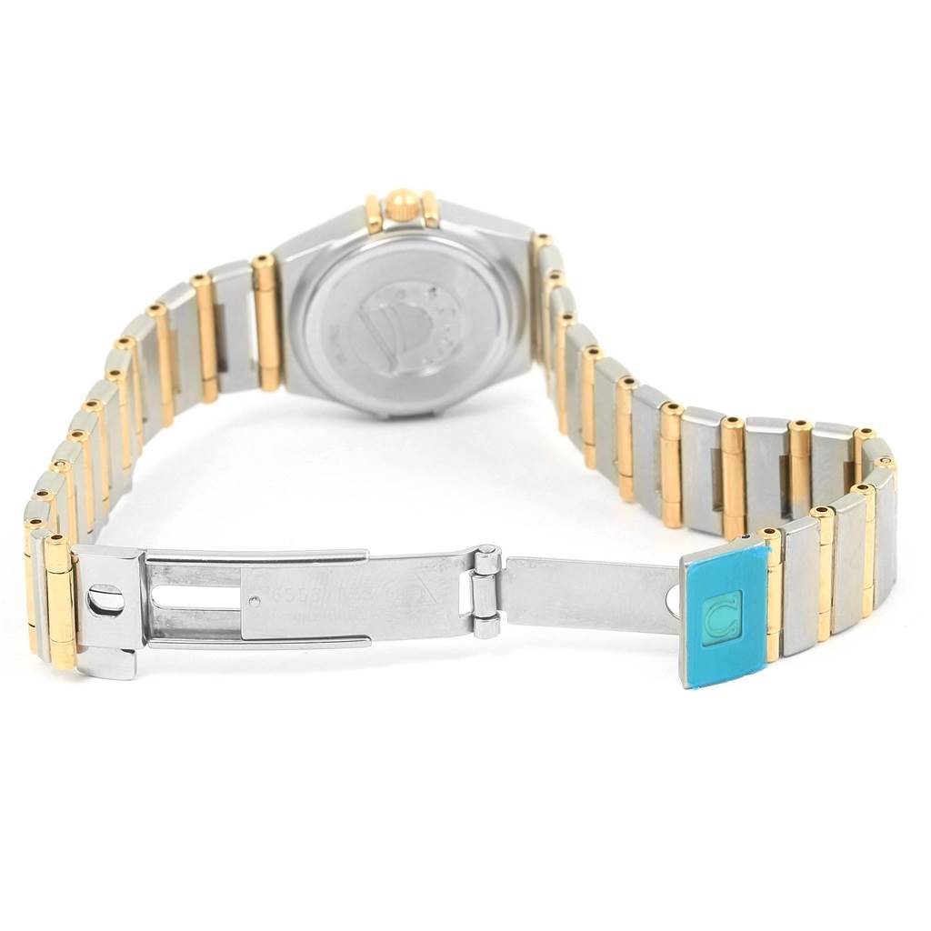 The image shows the back and bracelet of the Omega 1267.75.00 Women
s Steel and Gold (two tone) Mother of Pearl Dial 1267.75.00 Women
s Steel and Gold (two tone) Mother of Pearl Dial Constellation My Choice Mini Ladies Diamond Watch 1267.75.00, including the clasp.