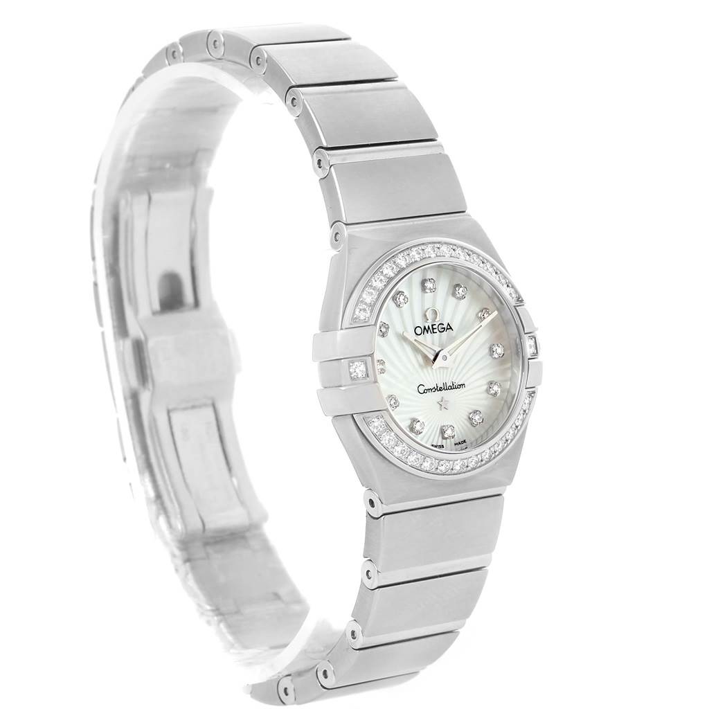 The image shows an Omega 123.15.24.60.55.004 Women's Stainless Steel Mother of Pearl Dial 123.15.24.60.55.004 Women's Stainless Steel Mother of Pearl Dial Constellation Quartz 24 MOP Diamond Watch 123.15.24.60.55.004 from a left side angle, including the face, band, and part of the clasp.