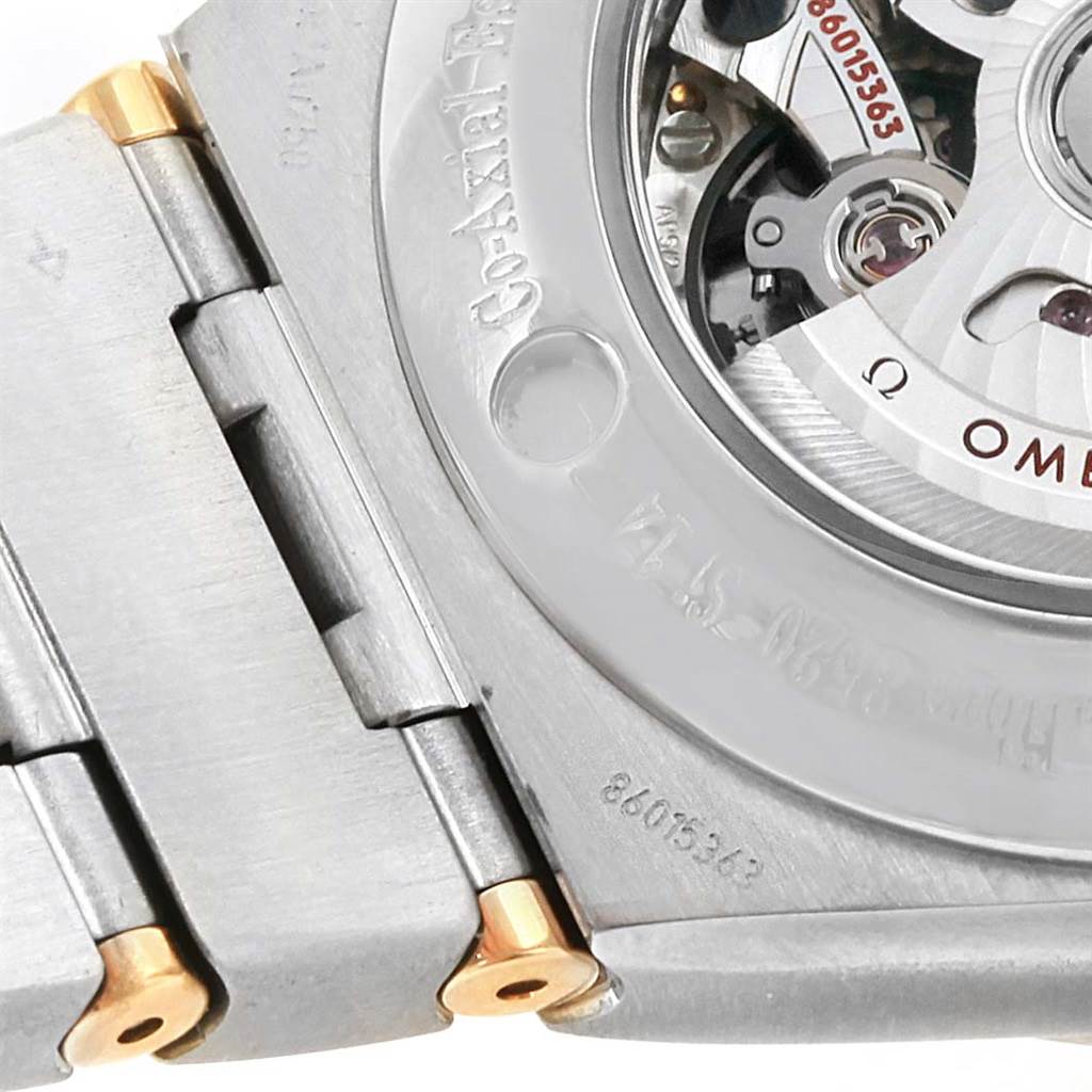 The image shows the back of the Omega 123.25.31.20.58.001 Women
s Steel and Gold (two tone) Champagne Dial 123.25.31.20.58.001 Women
s Steel and Gold (two tone) Champagne Dial Constellation 31 Co-Axial Diamond Ladies Watch 123.25.31.20.58.001, highlighting its movement and part of the bracelet.