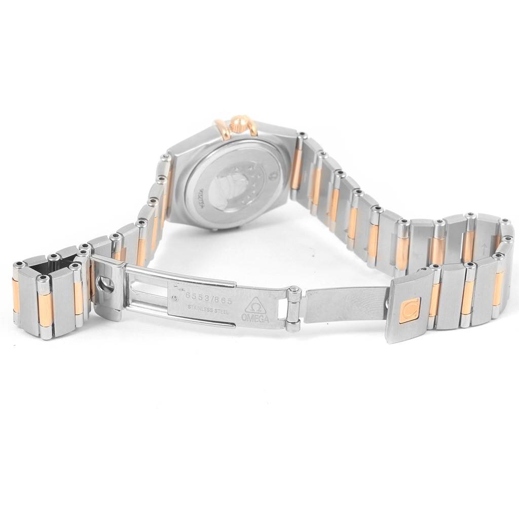The image shows the back and bracelet of an Omega 1360.75.00 Women's Steel and Gold (two tone) Mother of Pearl Dial 1360.75.00 Women's Steel and Gold (two tone) Mother of Pearl Dial Constellation My Choice Mini Diamond Watch 1360.75.00 with the clasp opened.