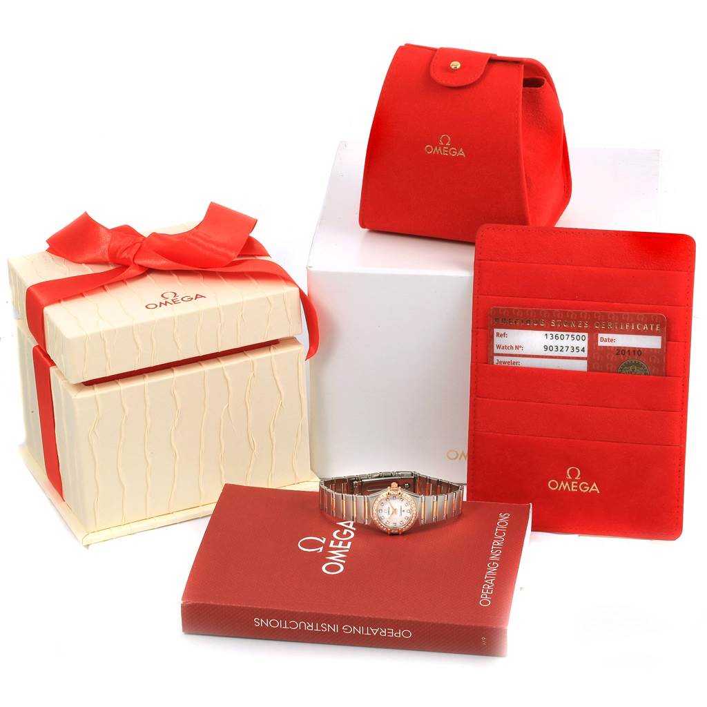 The image shows the Omega 1360.75.00 Women's Steel and Gold (two tone) Mother of Pearl Dial 1360.75.00 Women's Steel and Gold (two tone) Mother of Pearl Dial Constellation My Choice Mini Diamond Watch 1360.75.00, its box, papers, tag, and operating instructions.