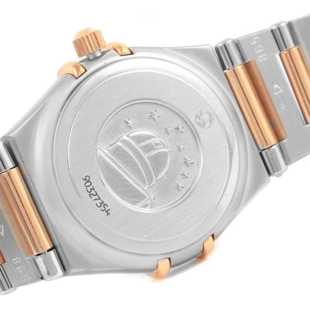 The image shows the back case and part of the bracelet of the Omega 1360.75.00 Women's Steel and Gold (two tone) Mother of Pearl Dial 1360.75.00 Women's Steel and Gold (two tone) Mother of Pearl Dial Constellation My Choice Mini Diamond Watch 1360.75.00.