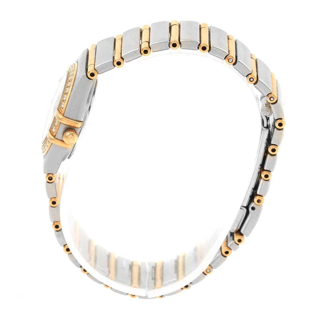 The image shows a side view of the Omega 1267.75.00 Women
s Steel and Gold (two tone) Mother of Pearl Dial 1267.75.00 Women
s Steel and Gold (two tone) Mother of Pearl Dial Constellation Mini MOP Diamond Ladies Watch 1267.75.00, focused on its band and crown.