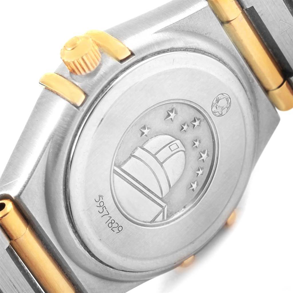 The image shows the back side of the Omega 1267.75.00 Women
s Steel and Gold (two tone) Mother of Pearl Dial 1267.75.00 Women
s Steel and Gold (two tone) Mother of Pearl Dial Constellation My Choice Mini MOP Diamond Ladies Watch 1267.75.00.