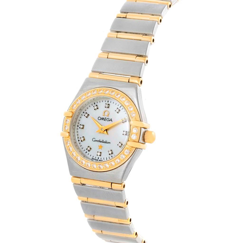The image shows an Omega 1267.75.00 Women
s Steel and Gold (two tone) Mother of Pearl Dial 1267.75.00 Women
s Steel and Gold (two tone) Mother of Pearl Dial Constellation My Choice Mini MOP Diamond Ladies Watch 1267.75.00 from a top angle, highlighting the dial, bezel, and bracelet.