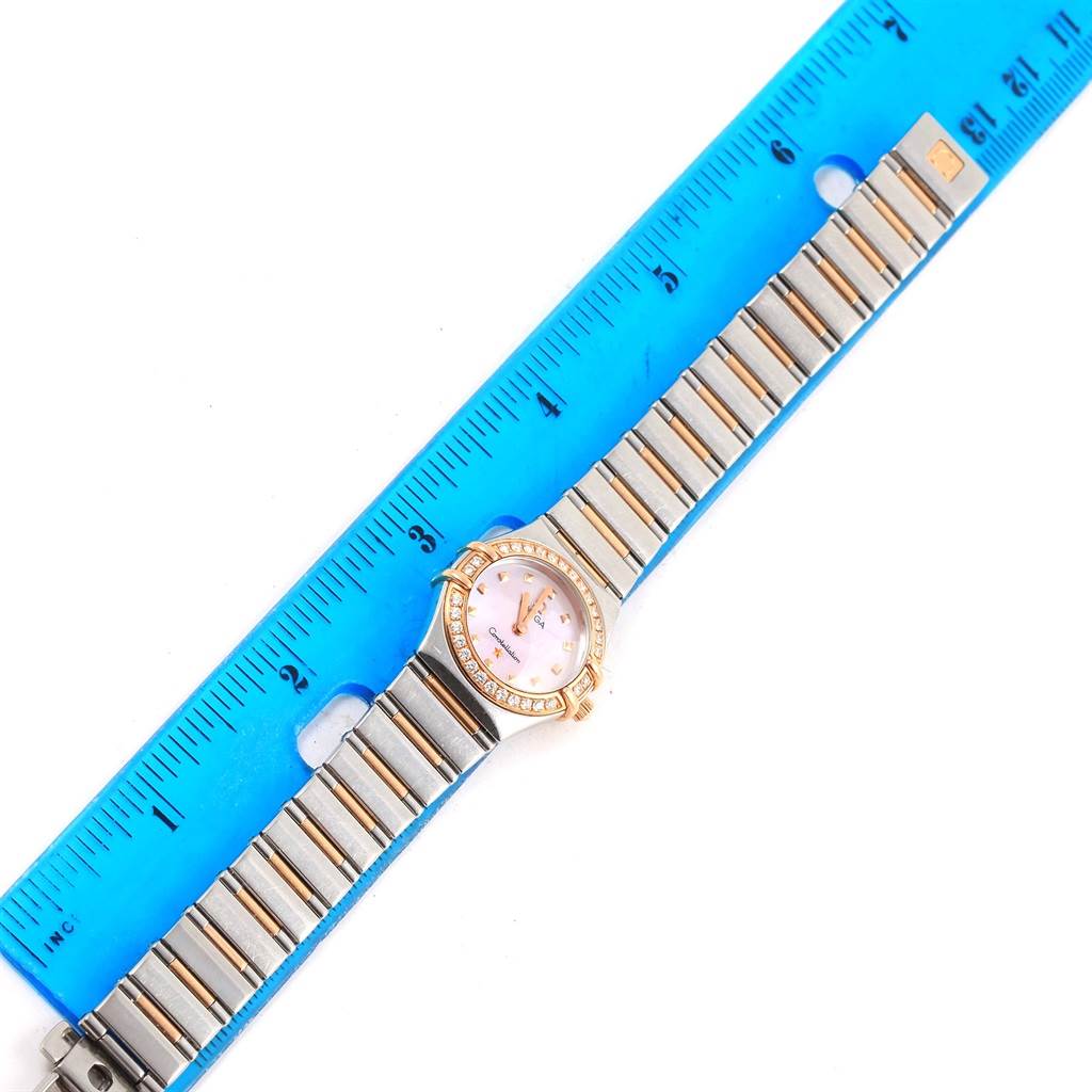 This image shows the face and band of the Omega 1368.71.00 Women's Steel and Gold (two tone) Mother of Pearl Dial 1368.71.00 Women's Steel and Gold (two tone) Mother of Pearl Dial Constellation My Choice Mini Diamond Ladies Watch 1368.71.00, measured against a ruler.
