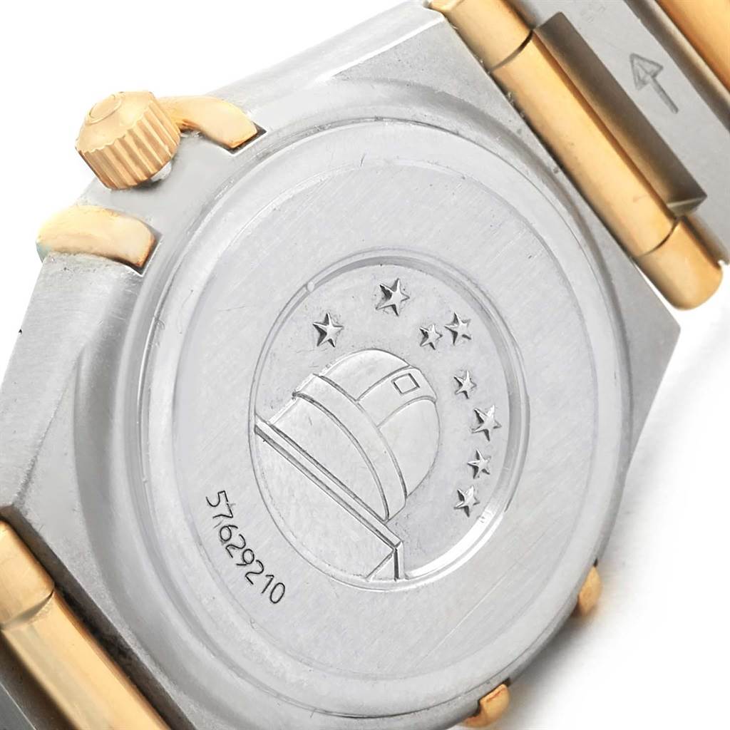 The image shows the back case and crown of the Omega 1267.75.00 Women's Steel and Gold (two tone) Mother of Pearl Dial 1267.75.00 Women's Steel and Gold (two tone) Mother of Pearl Dial Constellation Mini Mother of Pearl Diamond Watch 1267.75.00.