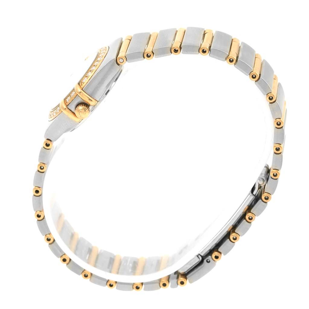 The side angle of the Omega 1267.75.00 Women's Steel and Gold (two tone) Mother of Pearl Dial 1267.75.00 Women's Steel and Gold (two tone) Mother of Pearl Dial Constellation Mini Mother of Pearl Diamond Watch 1267.75.00 showcases the bracelet and bezel.