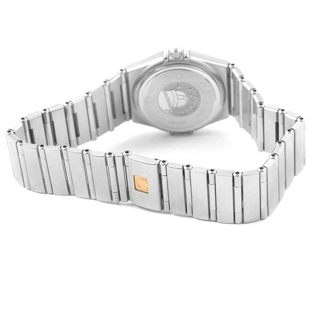 The image shows the back and bracelet of an Omega 123.15.24.60.55.004 Women's Stainless Steel Mother of Pearl Dial 123.15.24.60.55.004 Women's Stainless Steel Mother of Pearl Dial Constellation MOP Diamonds Ladies Watch 123.15.24.60.55.004.