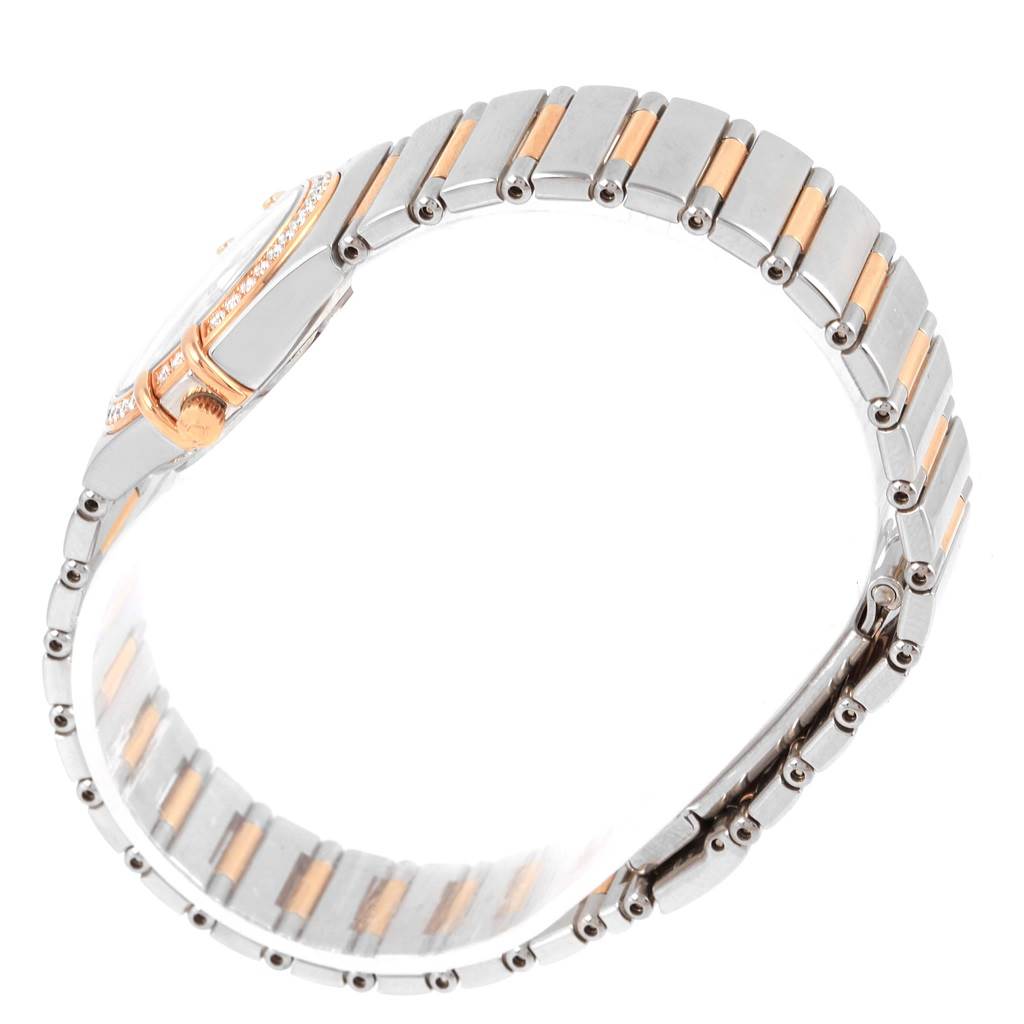 This image features a side view of the bracelet and case of the Omega 1465.79.00 Women
s Steel and Gold (two tone) Mother of Pearl Dial 1465.79.00 Women
s Steel and Gold (two tone) Mother of Pearl Dial Constellation Iris My Choice Steel Rose Gold Ladies Watch 1373.79.
