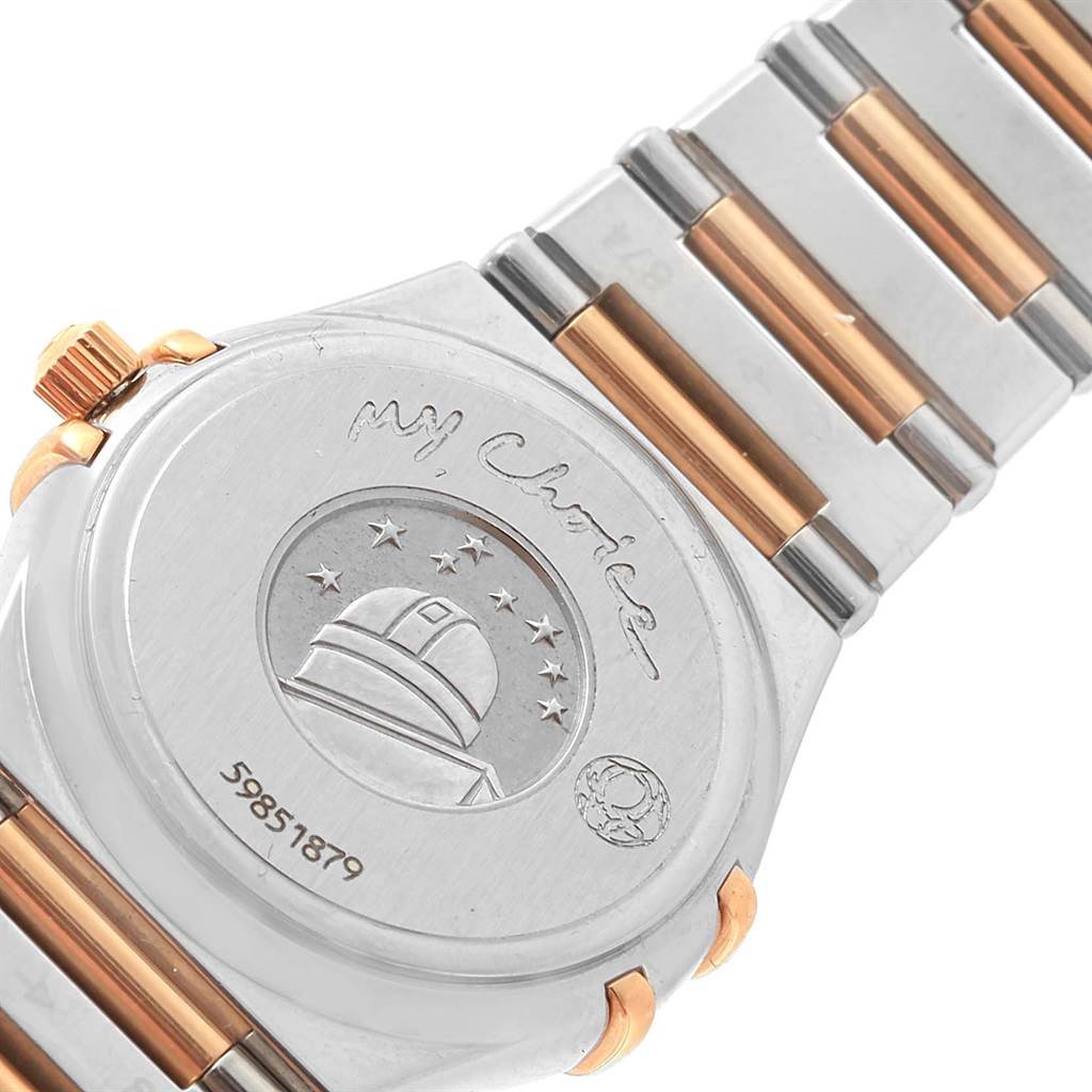 The image shows the back case and part of the bracelet of the Omega 1465.79.00 Women
s Steel and Gold (two tone) Mother of Pearl Dial 1465.79.00 Women
s Steel and Gold (two tone) Mother of Pearl Dial Constellation Iris My Choice Steel Rose Gold Ladies Watch, model 1373.79.