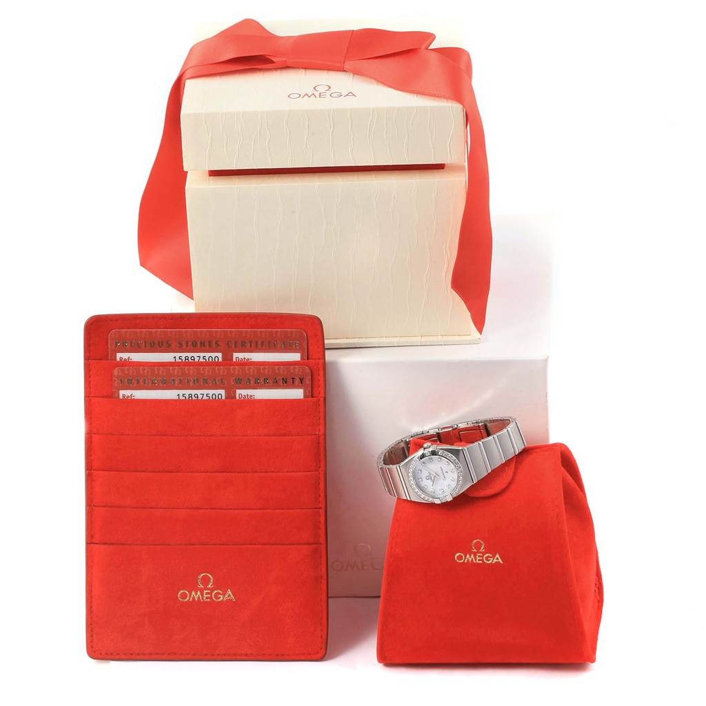 The image shows the Omega 1589.75.00 Women's Stainless Steel Mother of Pearl Dial 1589.75.00 Women's Stainless Steel Mother of Pearl Dial Constellation MOP Diamond Steel Ladies Watch model 1589.75.00 with its box and warranty case, angled frontally.