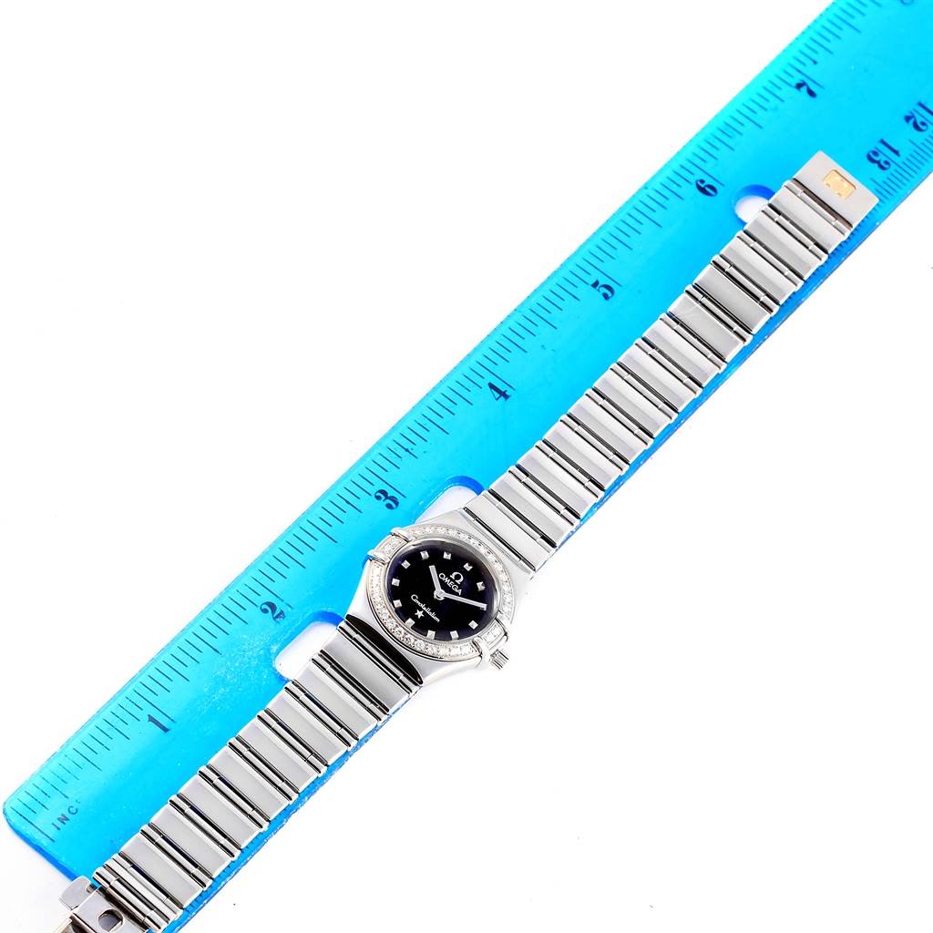 The Omega 1465.51.00 Women
s Stainless Steel Black Dial 1465.51.00 Women
s Stainless Steel Black Dial Constellation My Choice Mini Ladies Diamond Watch 1465.51.00 is shown flat with the entire bracelet and face visible, measured with a ruler.