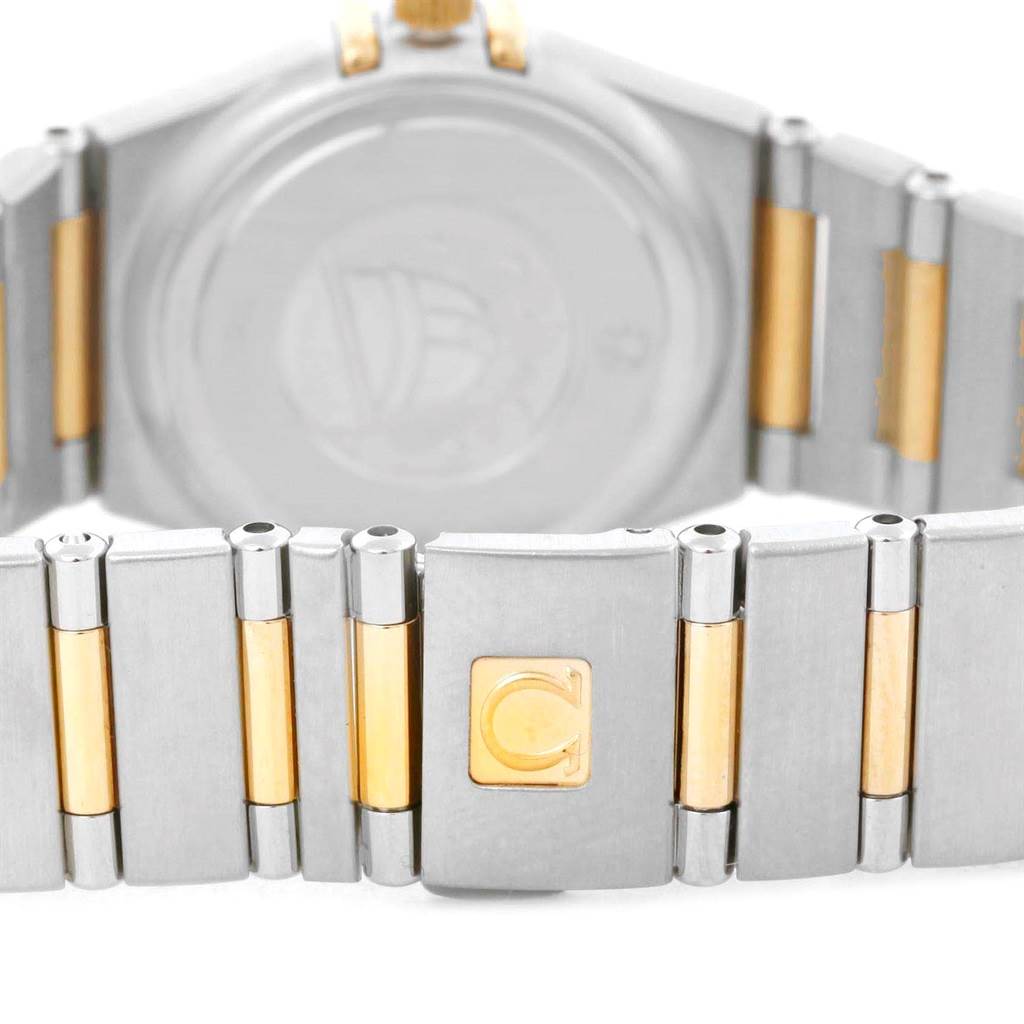 The image shows the clasp and part of the bracelet of the Omega 1365.79.00 Women
s Steel and Gold (two tone) Mother of Pearl Dial 1365.79.00 Women
s Steel and Gold (two tone) Mother of Pearl Dial Constellation Iris Steel Yellow Gold Multi Stone Watch, model 1365.79.00.