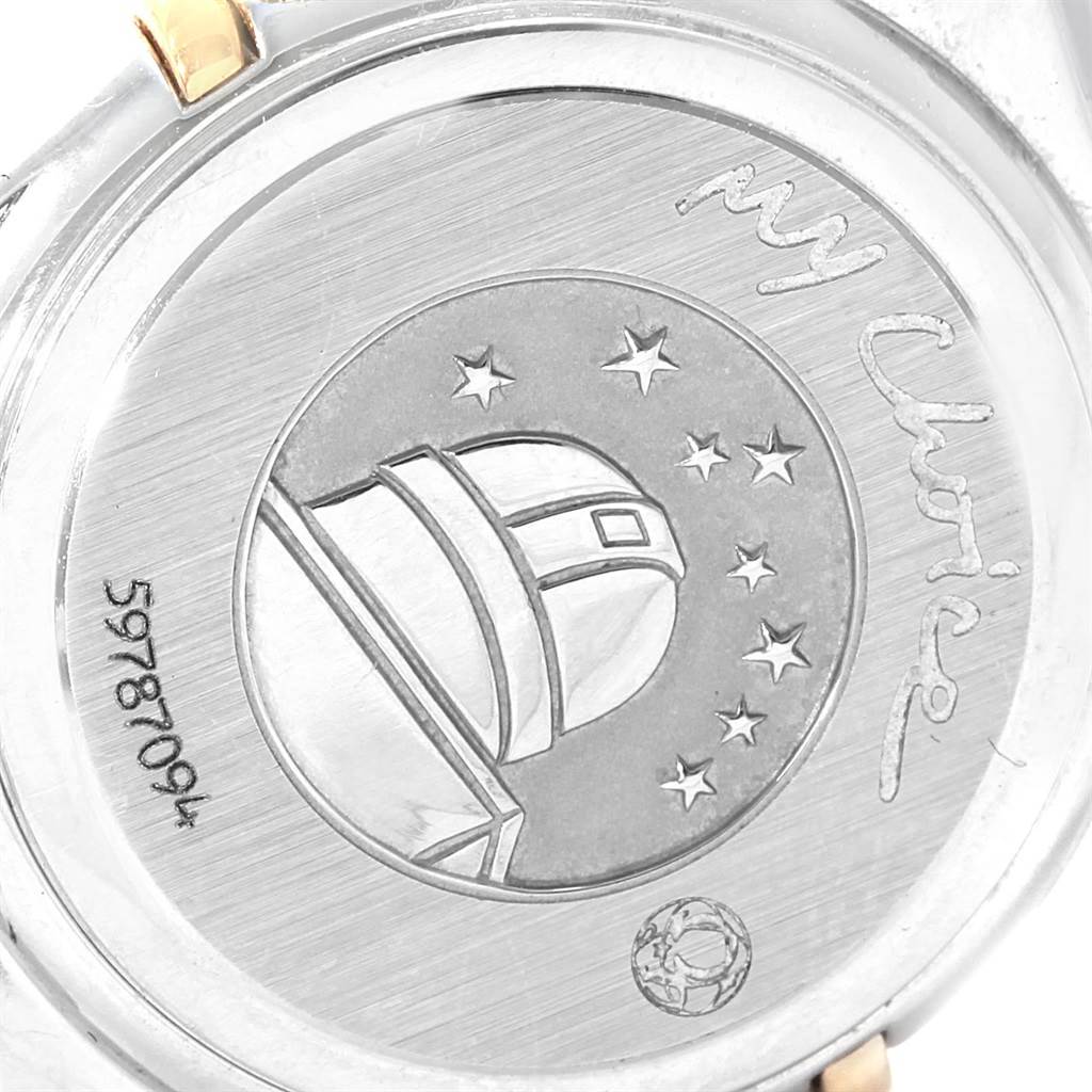 The image shows the back case of the Omega 1365.79.00 Women
s Steel and Gold (two tone) Mother of Pearl Dial 1365.79.00 Women
s Steel and Gold (two tone) Mother of Pearl Dial Constellation Iris Steel Yellow Gold Multi Stone Watch 1365.79.00, featuring an observatory and stars design.