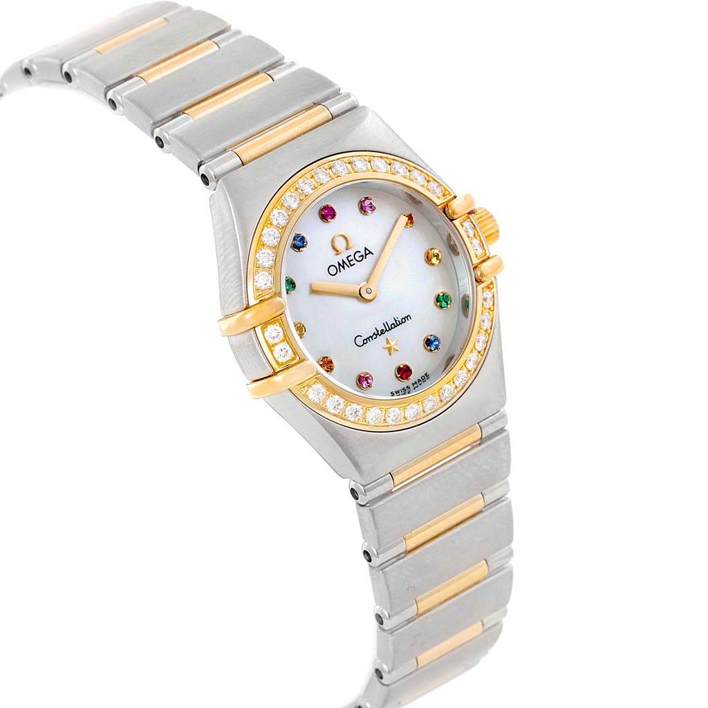 The image shows an angled view of the Omega 1365.79.00 Women
s Steel and Gold (two tone) Mother of Pearl Dial 1365.79.00 Women
s Steel and Gold (two tone) Mother of Pearl Dial Constellation Iris Steel Yellow Gold Multi Stone Watch 1365.79.00, highlighting its face, bezel, and bracelet.
