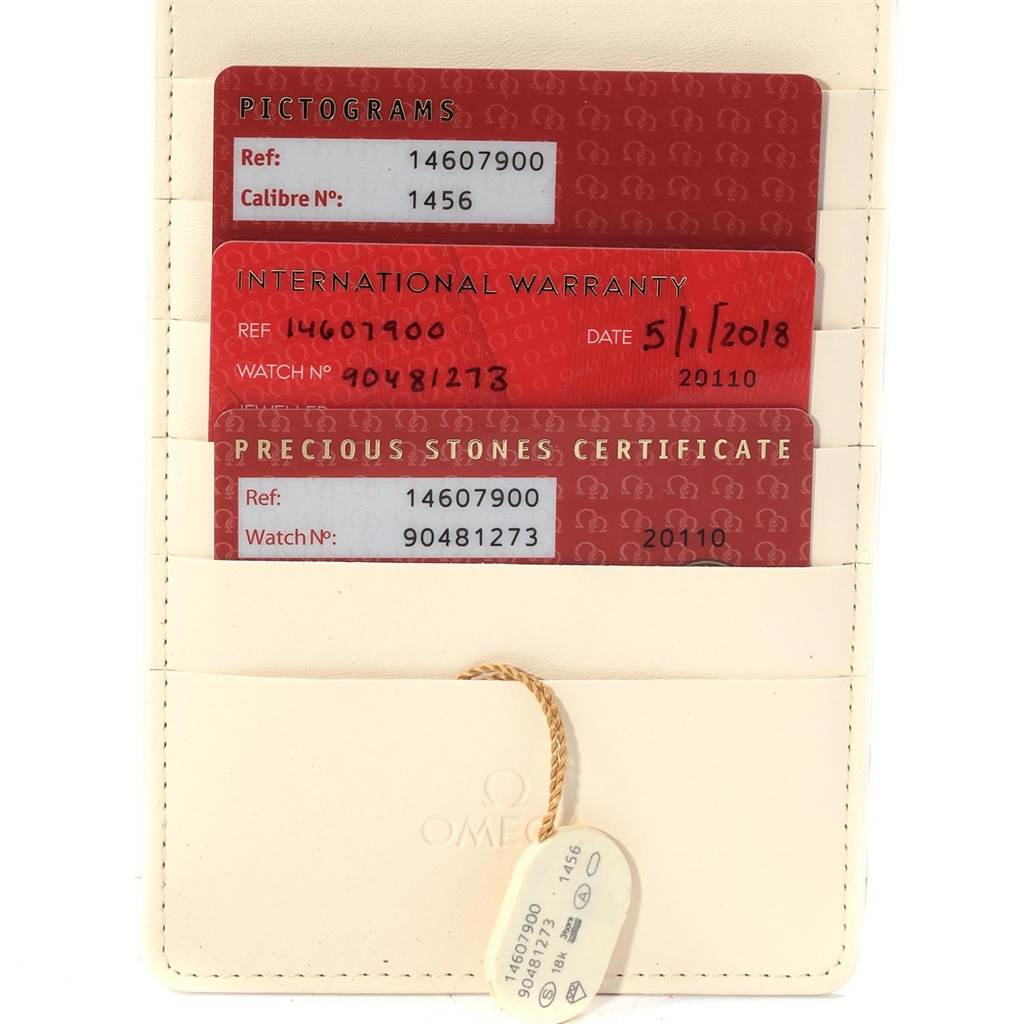 This image shows the box and card accessories for the Omega 1460.79.00 Women's Stainless Steel Mother of Pearl Dial 1460.79.00 Women's Stainless Steel Mother of Pearl Dial Constellation Iris Rainbow Multi Stone Watch 1460.79.00.