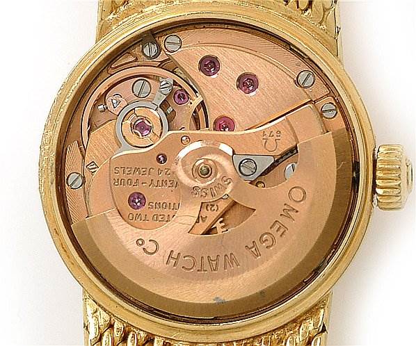 This image shows the internal mechanical movement of an Omega 7169 Women's Yellow Gold Champagne Dial 7169 Women's Yellow Gold Champagne Dial Vintage Ladies 18k Yellow Gold 7169 Watch.