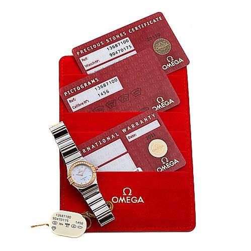 The image shows an Omega 13687100 OR 1368.   71.   00 Women's Rose Gold Mother of Pearl Dial 13687100 OR 1368.   71.   00 Women's Rose Gold Mother of Pearl Dial Steel 18k Rose Gold Diamond My Choice Watch 13687100 with warranty cards and a red Omega 13687100 OR 1368.   71.   00 Women's Rose Gold Mother of Pearl Dial 13687100 OR 1368.   71.   00 Women's Rose Gold Mother of Pearl Dial cardholder.