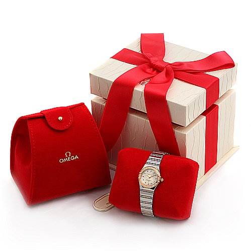 The image shows an Omega 13687100 OR 1368.   71.   00 Women's Rose Gold Mother of Pearl Dial 13687100 OR 1368.   71.   00 Women's Rose Gold Mother of Pearl Dial 13687100 My Choice watch with its steel-18k rose gold band and diamond dial, alongside red and white packaging.