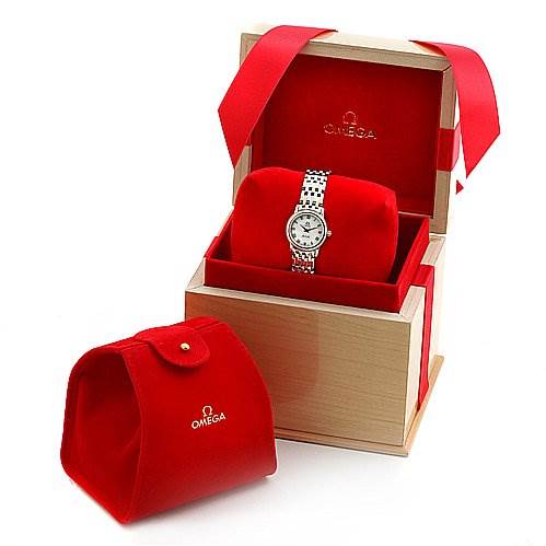 The Omega 43707100 Women
s Yellow Gold Mother of Pearl Dial 43707100 Women
s Yellow Gold Mother of Pearl Dial De Ville Prestige New Ladies Small Watch 43707100 is shown in its box with a red watch pouch beside it.