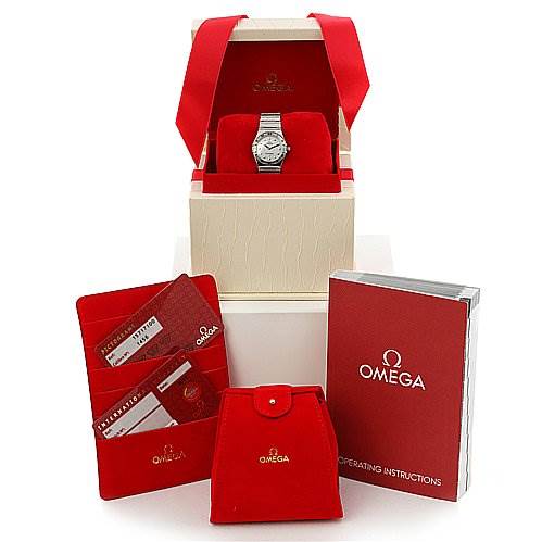 The image shows the Omega 15717100 OR 1571.   71.   00 Women
s Stainless Steel Mother of Pearl Dial 15717100 OR 1571.   71.   00 Women
s Stainless Steel Mother of Pearl Dial Constellation Small Quartz New Ladies 15717100 Watch, its box, instruction manual, and additional accessories.
