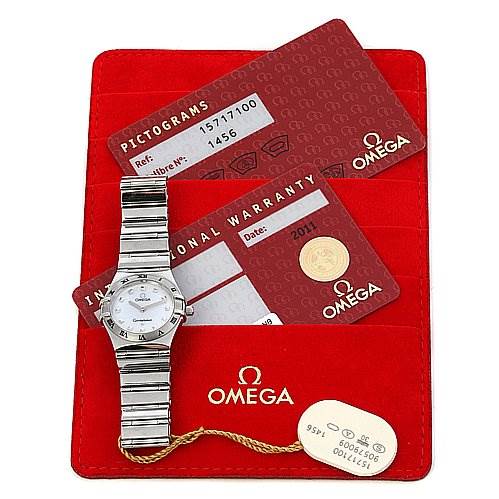 The image displays the Omega 15717100 OR 1571.   71.   00 Women
s Stainless Steel Mother of Pearl Dial 15717100 OR 1571.   71.   00 Women
s Stainless Steel Mother of Pearl Dial Constellation Small Quartz New Ladies 15717100 Watch along with its warranty cards and a red Omega 15717100 OR 1571.   71.   00 Women
s Stainless Steel Mother of Pearl Dial 15717100 OR 1571.   71.   00 Women
s Stainless Steel Mother of Pearl Dial pouch.
