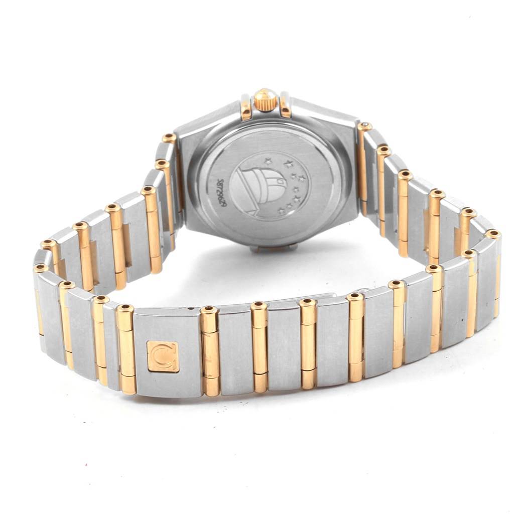 The image shows the back view of the Omega 1267.75.00 Women
s Steel and Gold (two tone) Mother of Pearl Dial 1267.75.00 Women
s Steel and Gold (two tone) Mother of Pearl Dial Constellation Mini Mother of Pearl Diamond Watch 1267.75.00, highlighting its bracelet and case back.