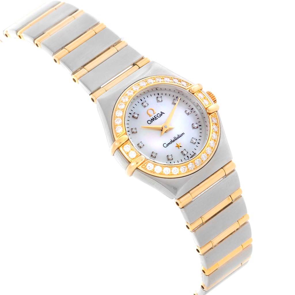 This Omega 1267.75.00 Women
s Steel and Gold (two tone) Mother of Pearl Dial 1267.75.00 Women
s Steel and Gold (two tone) Mother of Pearl Dial Constellation Mini Mother of Pearl Diamond Watch 1267.75.00 is shown at an angled view highlighting the face, bezel, and bracelet.