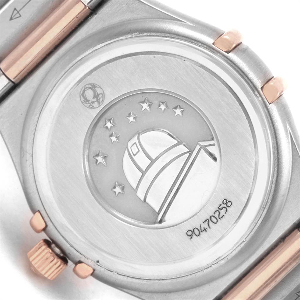 This image shows the case back and part of the bracelet of the Omega 1360.75.00 Women's Steel and Gold (two tone) Mother of Pearl Dial 1360.75.00 Women's Steel and Gold (two tone) Mother of Pearl Dial Constellation 95 MOP Diamond Steel Rose Gold Ladies Watch 1360.75.00.