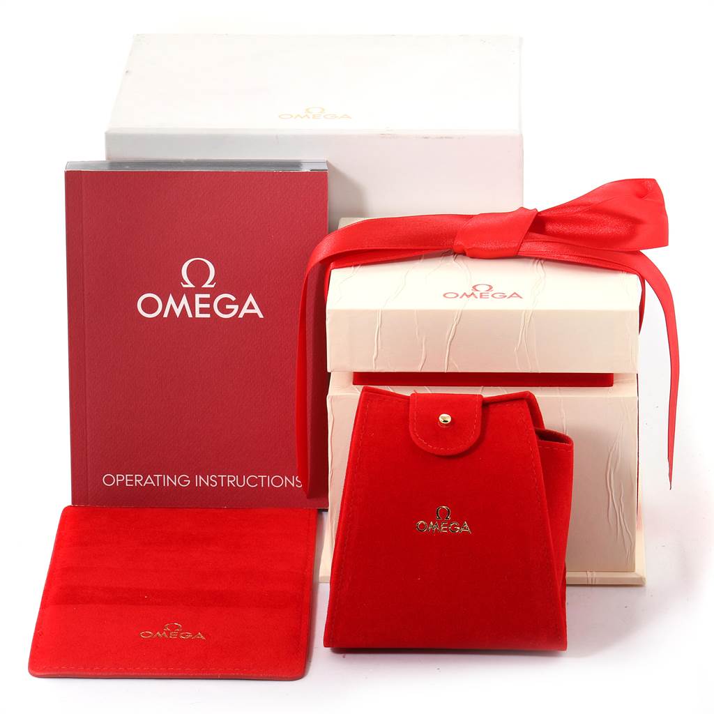 The image shows the accessories for the Omega 1365.71.00 Women's Steel and Gold (two tone) Mother of Pearl Dial 1365.71.00 Women's Steel and Gold (two tone) Mother of Pearl Dial Constellation Steel Yellow Gold Diamond Mini 1365.71.00, including its box, manual, and pouch.