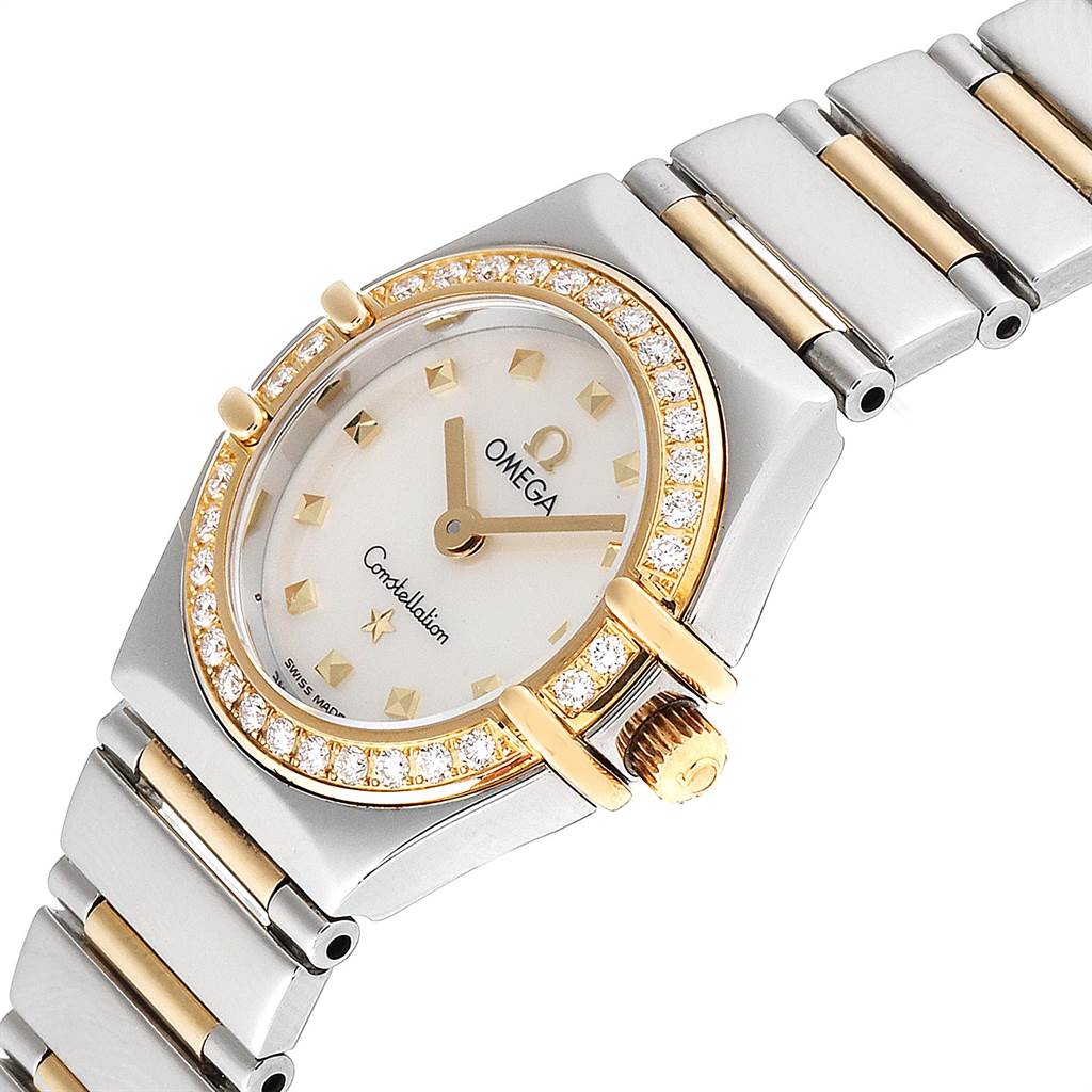 This image captures an angled view of the Omega 1365.71.00 Women's Steel and Gold (two tone) Mother of Pearl Dial 1365.71.00 Women's Steel and Gold (two tone) Mother of Pearl Dial Constellation Steel Yellow Gold Diamond Mini 1365.71.00 model, showing the face, bezel, and part of the bracelet.