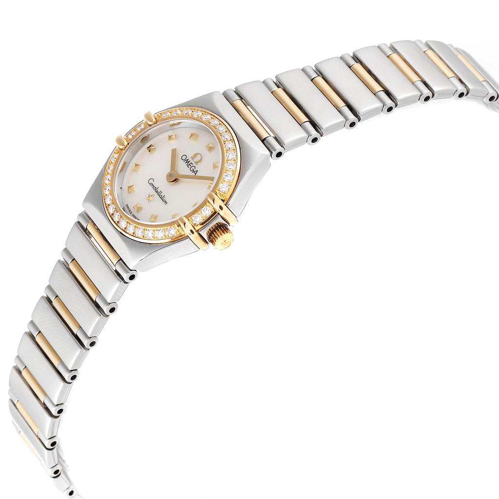 The image shows a Ladies Omega 1365.71.00 Women's Steel and Gold (two tone) Mother of Pearl Dial 1365.71.00 Women's Steel and Gold (two tone) Mother of Pearl Dial Constellation Steel Yellow Gold Diamond Mini 1365.71.00 watch at an angle highlighting the bracelet and bezel.