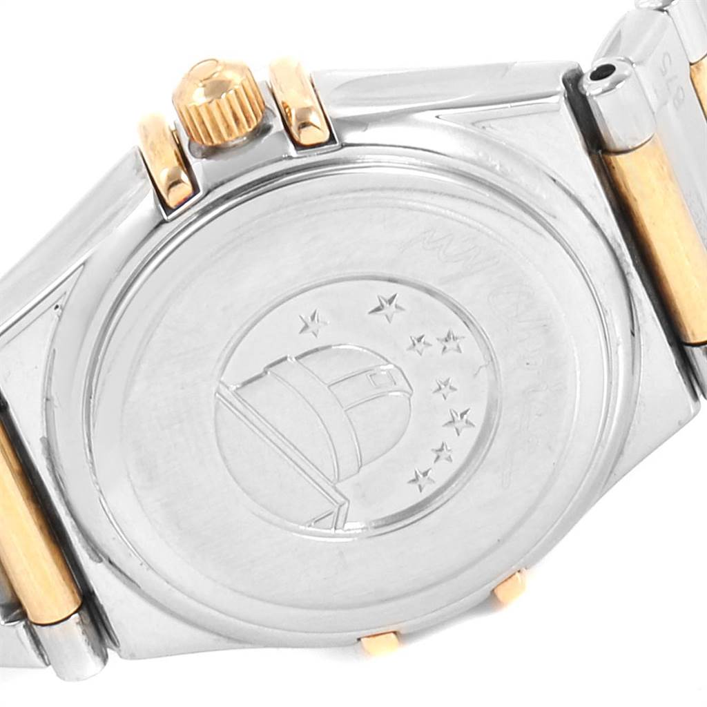 The image shows the case back and crown of the Omega 1365.71.00 Women's Steel and Gold (two tone) Mother of Pearl Dial 1365.71.00 Women's Steel and Gold (two tone) Mother of Pearl Dial Ladies Constellation Steel Yellow Gold Diamond Mini 1365.71.00 watch.