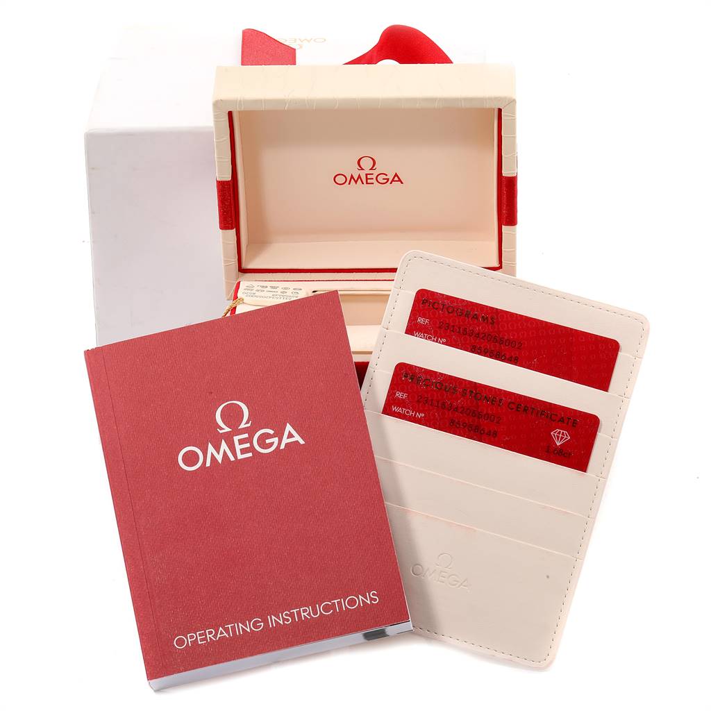 This image shows the packaging, instruction booklet, and certification cards for the Omega 231.15.34.20.55.002 Women's Stainless Steel Mother of Pearl Dial 231.15.34.20.55.002 Women's Stainless Steel Mother of Pearl Dial Aqua Terra 34 Steel Diamond Ladies Watch 231.15.34.20.55.002.