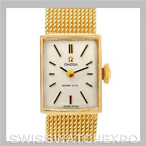 The image shows a front view of the Omega Women's Yellow Gold Silver Dial Women's Yellow Gold Silver Dial Vintage Ladies 14k Yellow Gold Watch Made For Tiffany, displaying its face, dial, and part of the band.